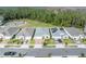 A street view displays well-maintained homes, some with solar panels, and manicured lawns at 7409 Wing Span Way, Harmony, FL 34773