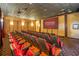 Movie theatre with comfortable red seating and a large screen displaying the Marvel Studios logo at 8939 Bismarck Palm Rd, Kissimmee, FL 34747