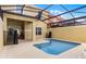 Private screened-in pool with a patio area, perfect for outdoor relaxation and entertaining at 8939 Bismarck Palm Rd, Kissimmee, FL 34747