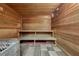 Modern sauna featuring natural wood paneling, a built-in bench, and a tiled floor at 8939 Bismarck Palm Rd, Kissimmee, FL 34747