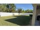 Large backyard with grassy area and privacy fence at 9271 Patrimonio Loop, Windermere, FL 34786