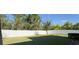 Large backyard with grassy area and privacy fence at 9271 Patrimonio Loop, Windermere, FL 34786