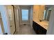 Bathroom with shower, double vanity, and tile flooring at 9271 Patrimonio Loop, Windermere, FL 34786