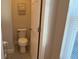 Small bathroom with toilet and single vanity at 9271 Patrimonio Loop, Windermere, FL 34786