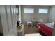Mickey Mouse themed bedroom with a bed, desk, and plenty of natural light at 9271 Patrimonio Loop, Windermere, FL 34786