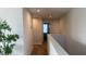 Upstairs hallway with light neutral walls and carpet at 9271 Patrimonio Loop, Windermere, FL 34786