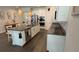 Open concept kitchen with an island and stainless steel appliances at 9271 Patrimonio Loop, Windermere, FL 34786