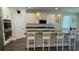 Modern kitchen with white cabinets, granite countertops, and an island at 9271 Patrimonio Loop, Windermere, FL 34786
