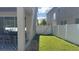 Side yard with gate and grassy area at 9271 Patrimonio Loop, Windermere, FL 34786