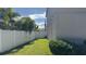 Side yard with privacy fence and landscaping at 9271 Patrimonio Loop, Windermere, FL 34786