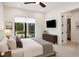 Sunlit bedroom with large windows, a ceiling fan, and an adjacent closet, creating a comfortable and stylish retreat at 10214 Chiltern Garden Dr, Orlando, FL 32827