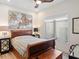 Guest bedroom with a sleigh bed and large window at 10214 Chiltern Garden Dr, Orlando, FL 32827