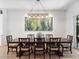 Elegant dining room with a large table and chandelier at 10214 Chiltern Garden Dr, Orlando, FL 32827