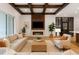 Bright living room featuring a decorative coffered ceiling, modern fireplace, and stylish furnishings at 10214 Chiltern Garden Dr, Orlando, FL 32827