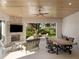 Relaxing outdoor patio with fireplace and golf course view at 10214 Chiltern Garden Dr, Orlando, FL 32827