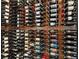 Full view of custom designed and installed temperature-controlled wine storage with wood trim at 10214 Chiltern Garden Dr, Orlando, FL 32827