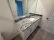 Bathroom with granite countertop and sink at 2334 Zaballina Pl, Kissimmee, FL 34747