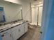Bathroom with granite countertop vanity, shower, and toilet at 2334 Zaballina Pl, Kissimmee, FL 34747
