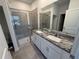 Bathroom with granite countertops and shower at 2334 Zaballina Pl, Kissimmee, FL 34747