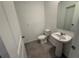 Simple bathroom with pedestal sink and tile flooring at 2334 Zaballina Pl, Kissimmee, FL 34747