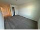 Bright bedroom with grey carpet and a closet at 2334 Zaballina Pl, Kissimmee, FL 34747