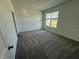 Bedroom with carpet flooring and window at 2334 Zaballina Pl, Kissimmee, FL 34747