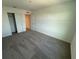 Simple bedroom with grey carpet and double door closet at 2334 Zaballina Pl, Kissimmee, FL 34747