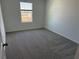 Bedroom with carpet and window at 2334 Zaballina Pl, Kissimmee, FL 34747