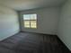 Bright bedroom with carpet flooring and window at 2334 Zaballina Pl, Kissimmee, FL 34747