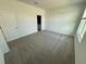 Bright bedroom with carpeted flooring and ensuite bathroom at 2334 Zaballina Pl, Kissimmee, FL 34747