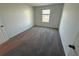 Simple bedroom with grey carpet and a window at 2334 Zaballina Pl, Kissimmee, FL 34747