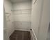 Walk-in closet with wire shelving and carpet flooring at 2334 Zaballina Pl, Kissimmee, FL 34747
