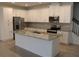 Modern kitchen with granite countertops and stainless steel appliances at 2334 Zaballina Pl, Kissimmee, FL 34747