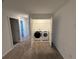 Laundry closet with Whirlpool washer and dryer at 2334 Zaballina Pl, Kissimmee, FL 34747