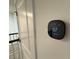 Smart thermostat installed on the wall at 2334 Zaballina Pl, Kissimmee, FL 34747