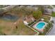 Aerial view of neighborhood featuring a pool and tennis court at 314 Cherokee Ct # H, Altamonte Springs, FL 32701
