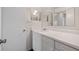 Bright bathroom features a large mirror and white vanity at 314 Cherokee Ct # H, Altamonte Springs, FL 32701