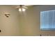 Simple bedroom with ceiling fan and window coverings at 314 Cherokee Ct # H, Altamonte Springs, FL 32701