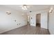 Bright bedroom featuring sleek wood floors, ceiling fan, and interesting lighting at 314 Cherokee Ct # H, Altamonte Springs, FL 32701