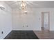 Charming dining area featuring tiled floors, decorative wall sconces, and a chandelier for ambient lighting at 314 Cherokee Ct # H, Altamonte Springs, FL 32701
