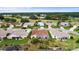 Aerial view of homes in a neighborhood close to a green space and lakes at 4731 Summerbridge Cir, Leesburg, FL 34748