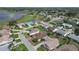 Aerial view of a residential neighborhood, golf course, and lake, showcasing the community and surrounding nature at 4731 Summerbridge Cir, Leesburg, FL 34748