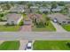 Single-story home with mature landscaping and brick driveway in a residential neighborhood at 4731 Summerbridge Cir, Leesburg, FL 34748
