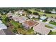 An aerial view showcasing a charming residential community with well-maintained homes and lush green lawns at 4731 Summerbridge Cir, Leesburg, FL 34748