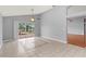 Cozy living area with tile floors, a sliding door to the patio, and a ceiling fan at 4731 Summerbridge Cir, Leesburg, FL 34748