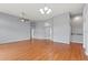 Bright living room boasts wood floors, modern lighting, and an open floor plan at 4731 Summerbridge Cir, Leesburg, FL 34748