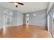 Spacious living room featuring wood floors, high ceilings, and natural light at 4731 Summerbridge Cir, Leesburg, FL 34748