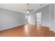 Spacious main bedroom with vaulted ceilings and wood flooring, leading to an en-suite bathroom at 4731 Summerbridge Cir, Leesburg, FL 34748