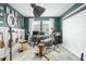Music room with a recording setup and a collection of musical instruments, set against deep green walls at 6115 Claystone Way, Mount Dora, FL 32757