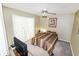 Charming bedroom with a double bed and lots of natural light at 704 Monroe Harbor Pl, Sanford, FL 32773